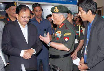Army Chief General Bipin Rawat briefing the minister at the exhibition organised on the sidelines of the seminar