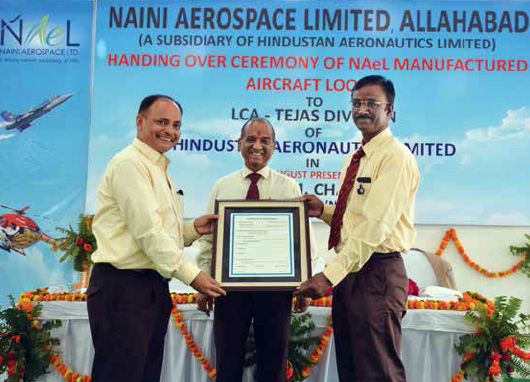Mr. R. K. Mishra, CEO, NAeL (left) presenting the Certificate of Conformity of aircraft and helicopter looms to Mr. M S Velpari, GM, LCA Tejas Division-HAL (right) in the presence of Mr. V M Chamola, Chairman (NAeL) and Director (HR)-HAL at a function held at Naini, Allahabad